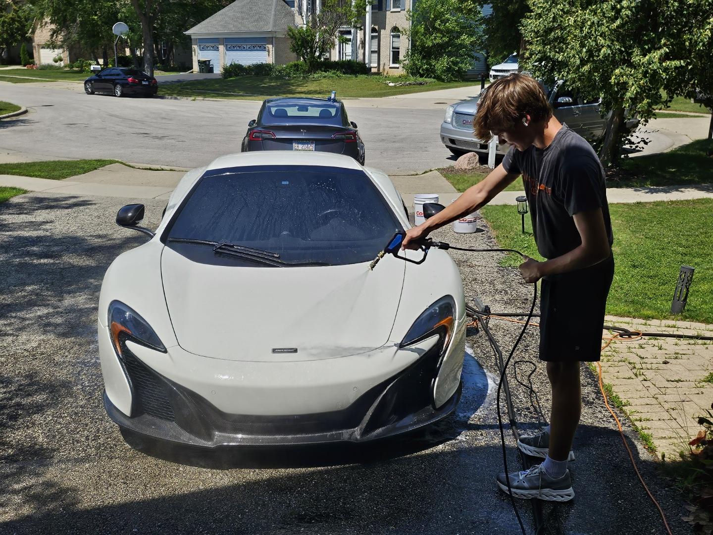 Nathan, owner of Arlington Auto Detailing, in action